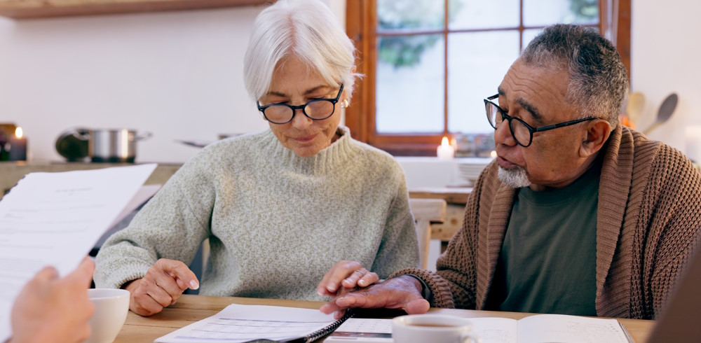 Couple reading and discussing important paperwork