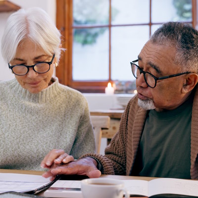 Couple reading and discussing important paperwork