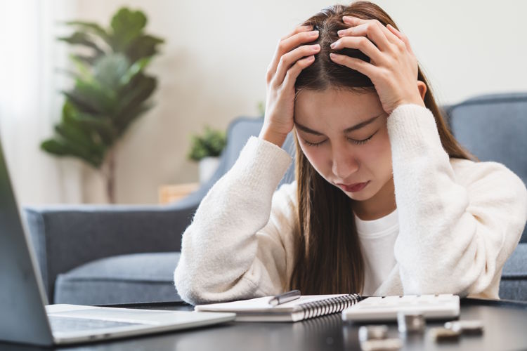 young adult is nervous after calculating loan expense young adult is nervous after calculating loan expense
