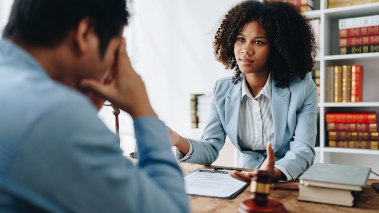 lawyers discussing client's case