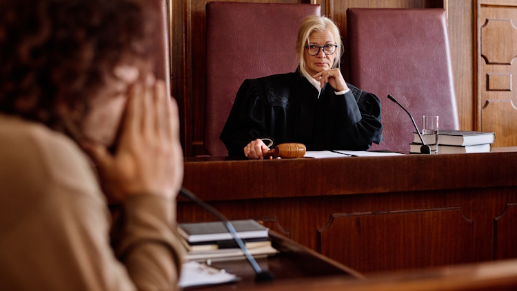 Serious judge looking at suspect Serious judge looking at suspect