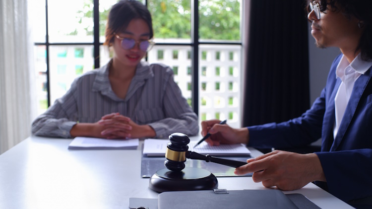 Legal lawyer discussing case options to young lady Legal lawyer discussing case options to young lady