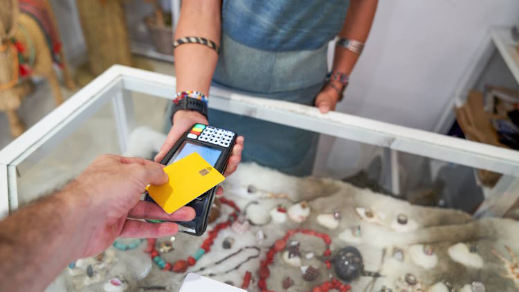 Man paying for an item at a pawn shop Man paying for an item at a pawn shop