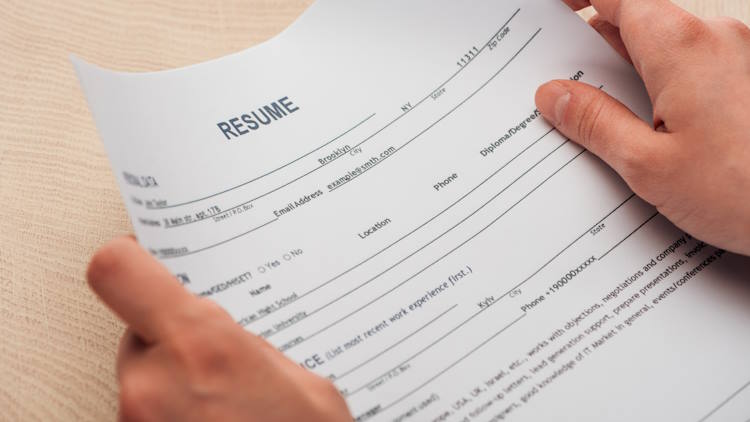recruiter holding resume recruiter holding resume